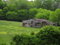This abandoned barn once stood in the Chestua community outside of Madisonville Tennessee It was torn down a few years ago after a storm caused the structure to partially collapse
