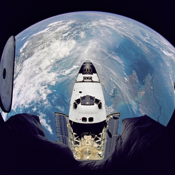  Fish-eye view of the Space Shuttle Atlantis as seen from the Russian Mir space station  photo NASA