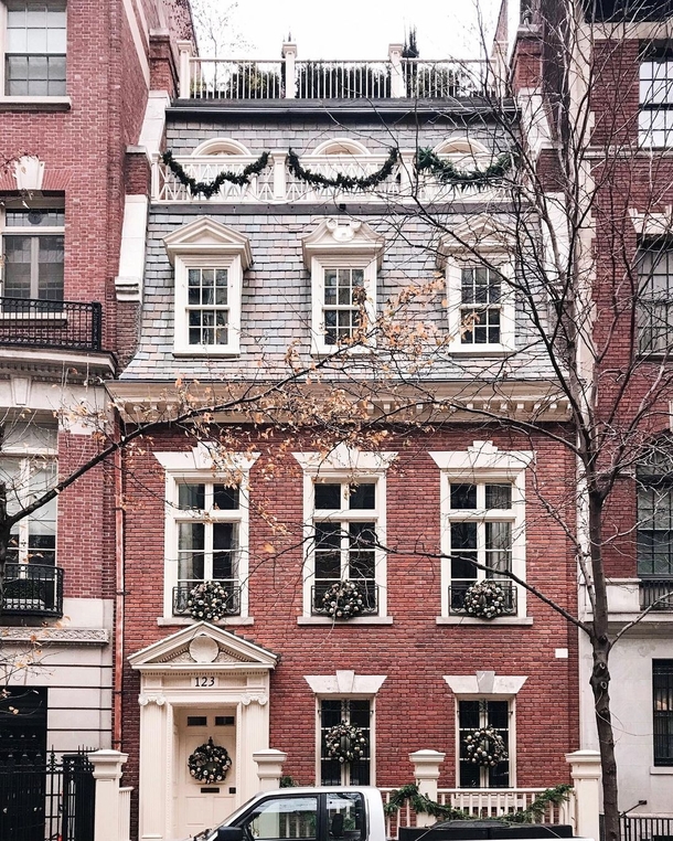  Georgian Revival townhouse with a mansard roof in Upper East Side Manhattan New York City