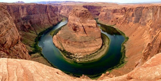  I know this pic has probably been posted here a million times But this was my first visit and reaching over the cliff to get this shot of Horse Shoe Bend AZ was a dream come true