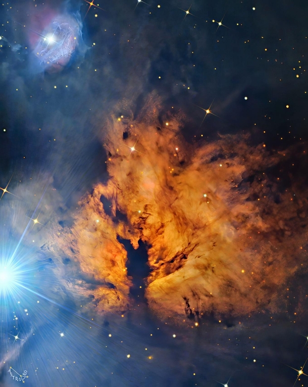  light years away towards the constellation of Orion lies a nebula which from its glow and dark dust lanes appears like a billowing fire The bright star Alnitak  see comments 