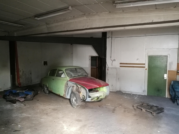  Old SAAB parked in a workshop in Sweden house now demolished