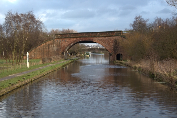 A boating canal with an arched bridge in Wakefield 