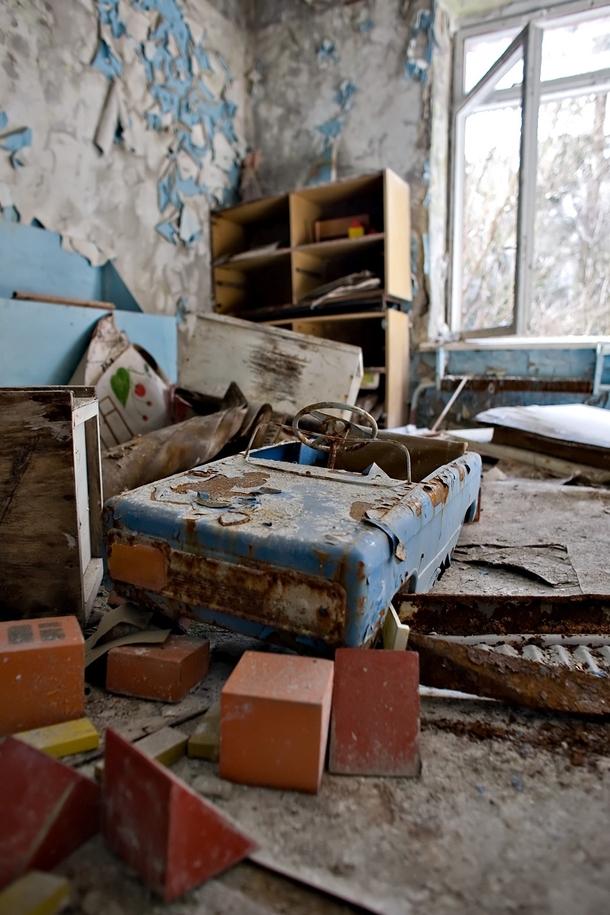 A childs pedal toy car hastily left in one of the kindergarten rooms Pripyat Ukraine 