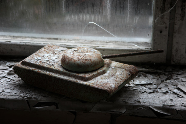 A childs toy tank left on a window ledge in an elementary school Untouched for decades now Chernobyl Ukraine 