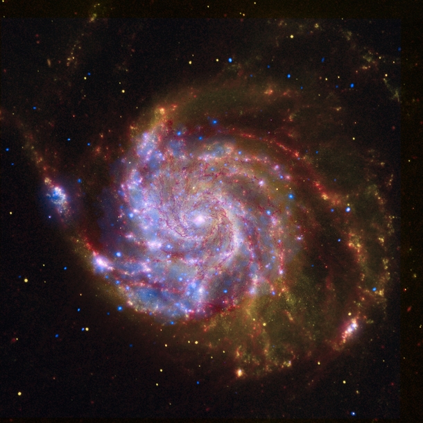 A composite view of the spiral galaxy Messier  from Spitzer Hubble and Chandra 