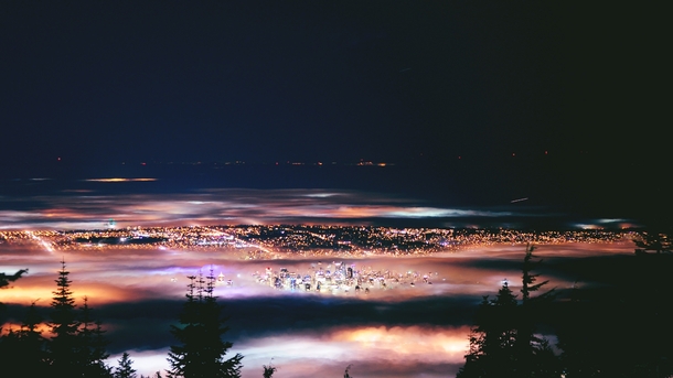 A fog-shrouded Vancouver at night x 