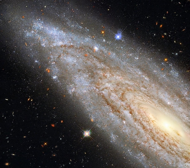 A galactic powerhouse This image shows the spiral galaxy NGC  observed using Hubbles Wide Field Camera  WFC