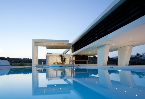 A house in Athens Greece that was designed to give the sense of hovering over the water and sailing inspired by the owners love for yachts 