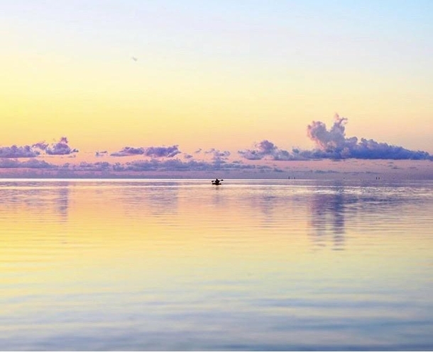 A kayaker during sunset in Tampa Bay
