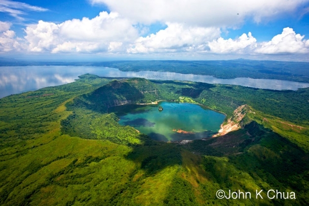 A lake within a lake - Taal Volcano Philippines  by John K Chua