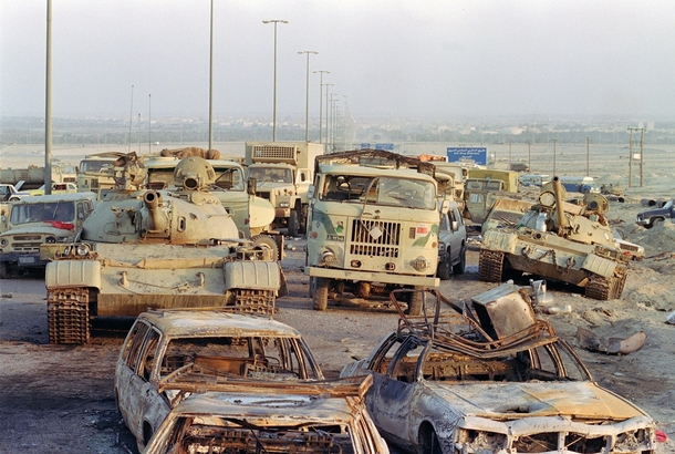 A long line of vehicles including destroyed Iraqi Army Russian-made T- tanks and trucks stand abandoned by fleeing Iraqi troops on the outskirts of Kuwait City on March   Pascal Guyot 