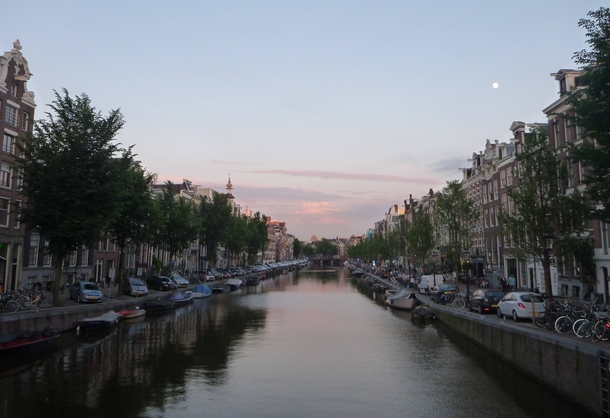 A lovely Amsterdam evening Full moon in the evening sky 