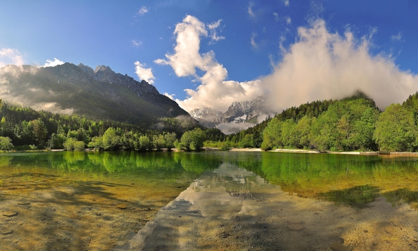 A Moment - on Lake Jasna in Kranjska Gora Slovenia  by Gitta Sladi