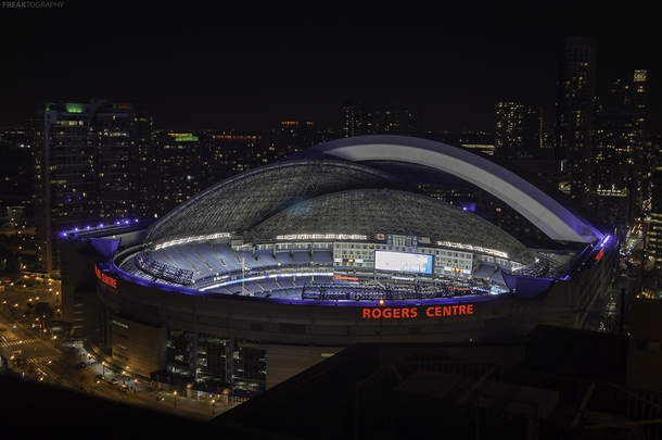 A night time view of the Rogers Center in Downtown Toronto as the dome begins to close OC 
