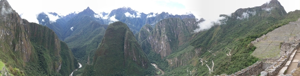 A panoramic view looking out from Machu Picchu onto the valley below 