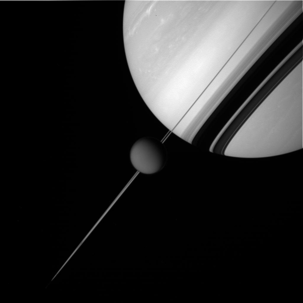 A picture of Saturn and Titan shot by the Cassini spacecraft from a distance of  miles  kilometers from Titan 