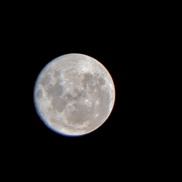 A simple shot of the Harvest Moon  taken with my iPhone XS looking through a Meade Polaris  telescope Still learning how to use it 