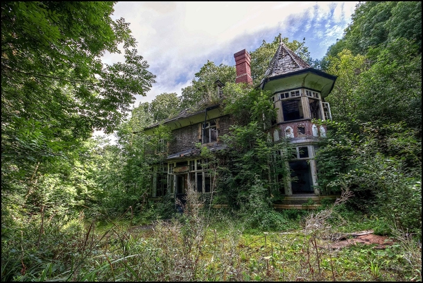 A small abandoned Manor house in South Wales slowly being re-claimed by nature after its occupants left 
