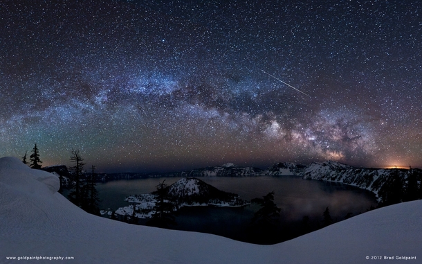 A starry night over Crater Lake Oregon USA  by Brad Goldpaint