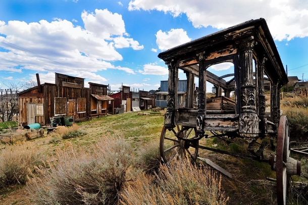 A strange little theme park ghost town complete with funeral wagon I found in Nevada OC x