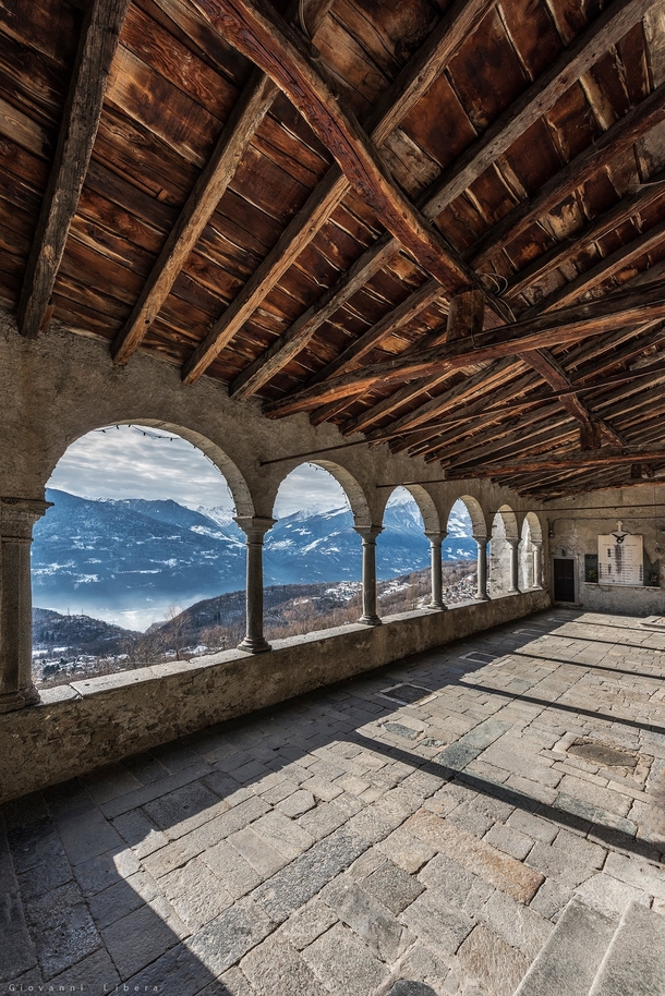 Abandoned balcony overlooking the Alps in Italy 