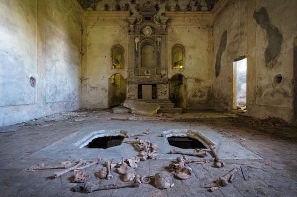 Abandoned church with bones displayed from crypt below 