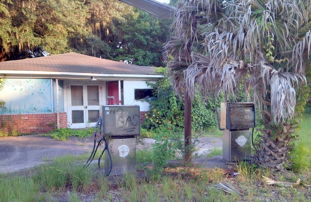 Abandoned Gas Station St Helena Island South Carolina August  note the Palmetto Palm growing in front of pump 