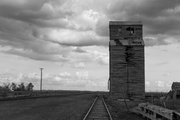 Abandoned grain elevator on railroad siding Comanche NE 