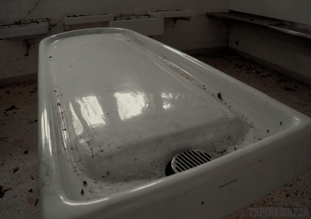 Abandoned Morgue in Ireland The embalming table is swivel-ready porcelain slab in near-perfect condition