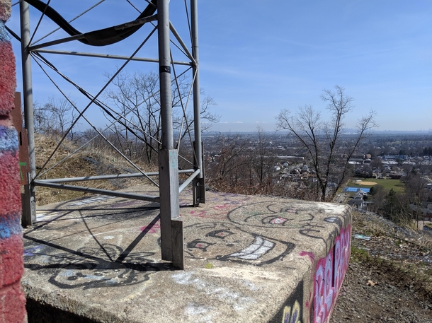 Abandoned radio antenna perched on a cliff in Clifton NJ that I stumbled across on a hike You can faintly see the NYC skyline in the background though unfortunately it was a bit foggy this morning