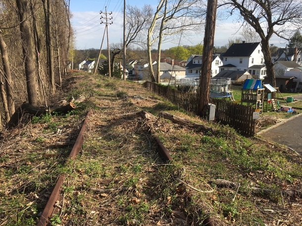 Abandoned railroad tracks on berm above existing homes Summit NJ