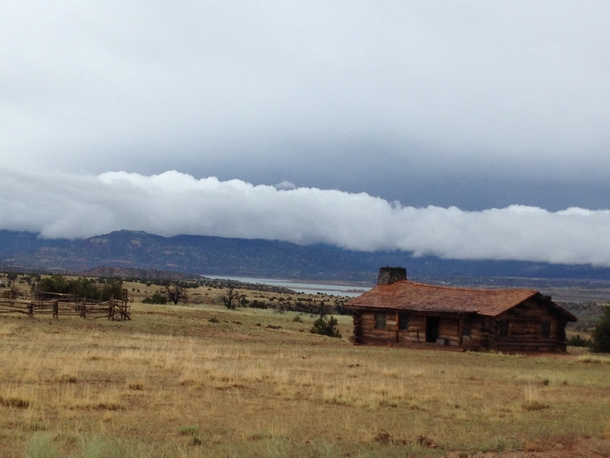Abandoned timber house after the storm Ghost Ranch NM  