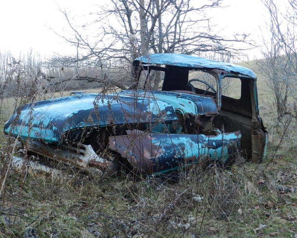 Abandoned truck in a field 