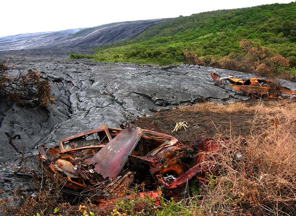 Abandoned vehicles are consumed by lava at the Royal Gardens near the base of the Pali 