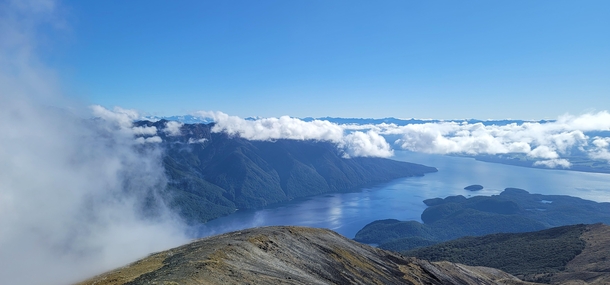 Above the clouds Mt Luxmore overlooking Lake Te Anau South Island New Zealand 