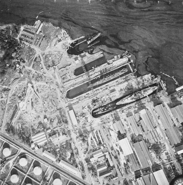 Aerial view of the dry docks at Pearl Harbor on  December  showing damage from the Japanese raid three days earlier 