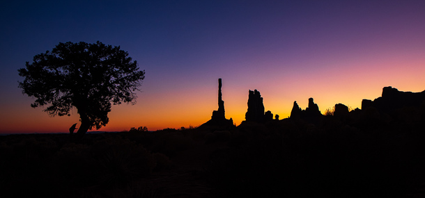am morning silhouette of Monument Valley Utah 