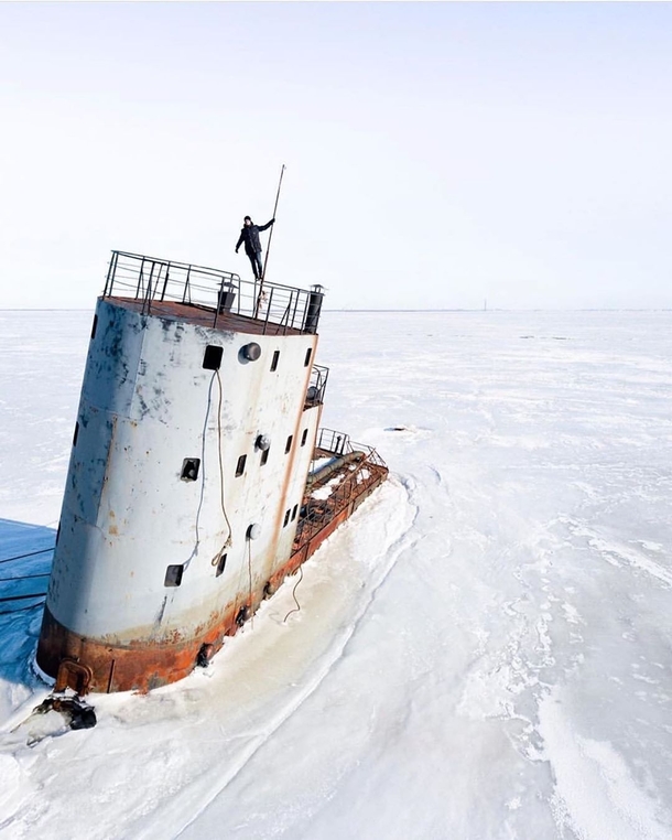 An abandoned nuclear ice breaker burried beneath the thick layers of snow in Kronstadt Russia