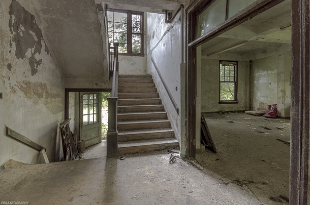 An excellent abandoned building in New York State natural light lots of great staircases and decay oc x
