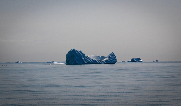 An iceberg looking extra slick in the evening sun Disko Island Greenland 