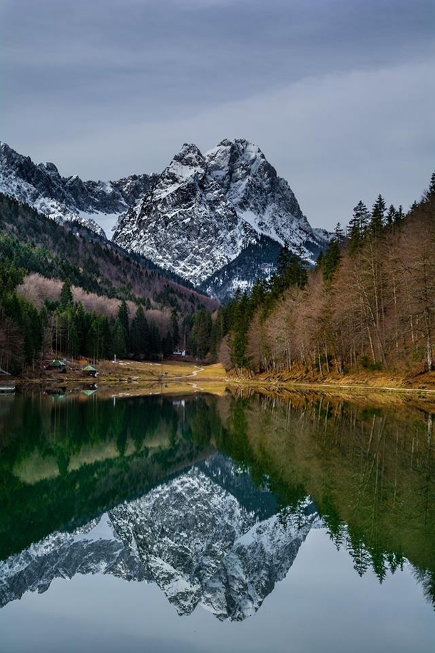An impecable reflection of Alpspitze in Reissersee Garmisch Germany 
