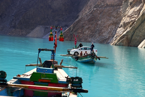 An improvised ferry in Attabad Lake Northern Pakistan  By Asad Munir 