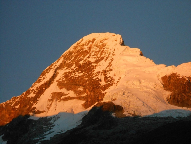 Artesonraju glowing in the early morning better known as the mountain used for the Paramount Pictures logo Cordillera Blanca Range Peru  OC