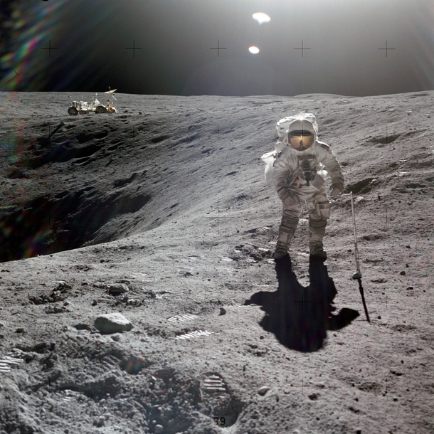 Astronaut Charles M Duke Jr lunar module pilot of the Apollo  lunar landing mission is photographed collecting lunar samples at Station no  during the first Apollo  extravehicular activity at the Descartes landing site 