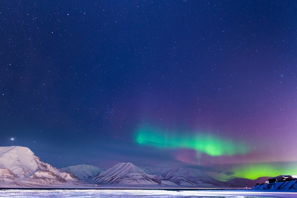 Aurora borealis over Adventfjorden in Longyearbyen Svalbard OC 