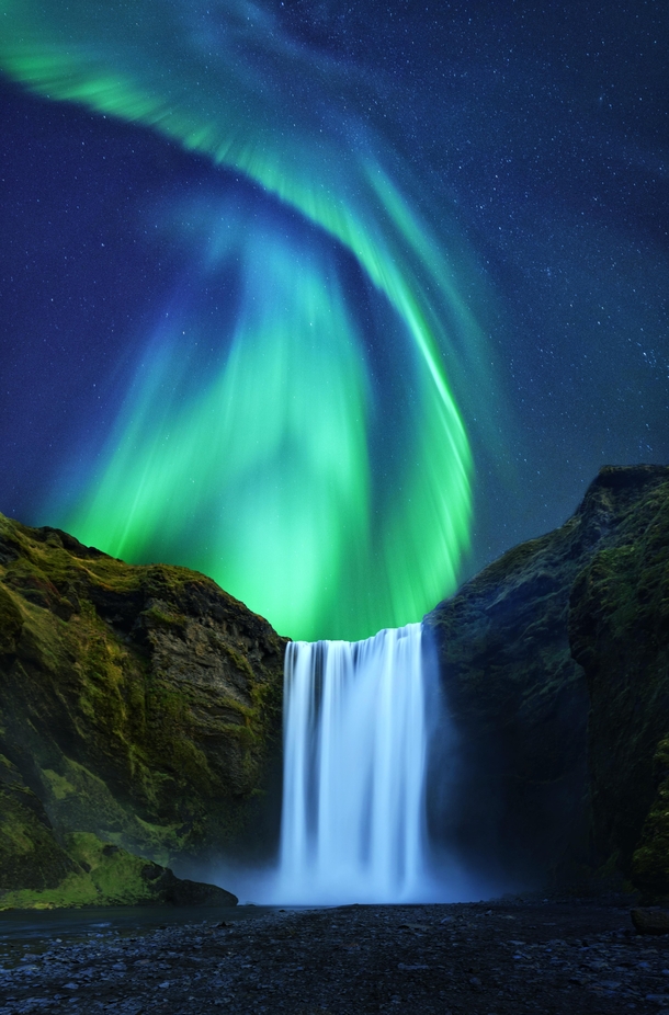 Aurora over the mighty Skogafoss in Iceland 