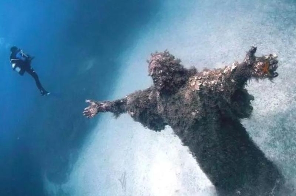 Awesome bronze statue of the Christ of the Abyss in San Fruttuoso Italy