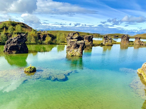 Beautiful rock formations at Hofdi Nature Reserve Iceland We almost skipped this stop since there were only - cars parked out there Turned out to be an amazing place with crystal clear water and vistas akin to a painting 