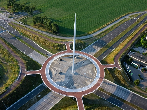 Bike roundabout above busy car intersection NL 